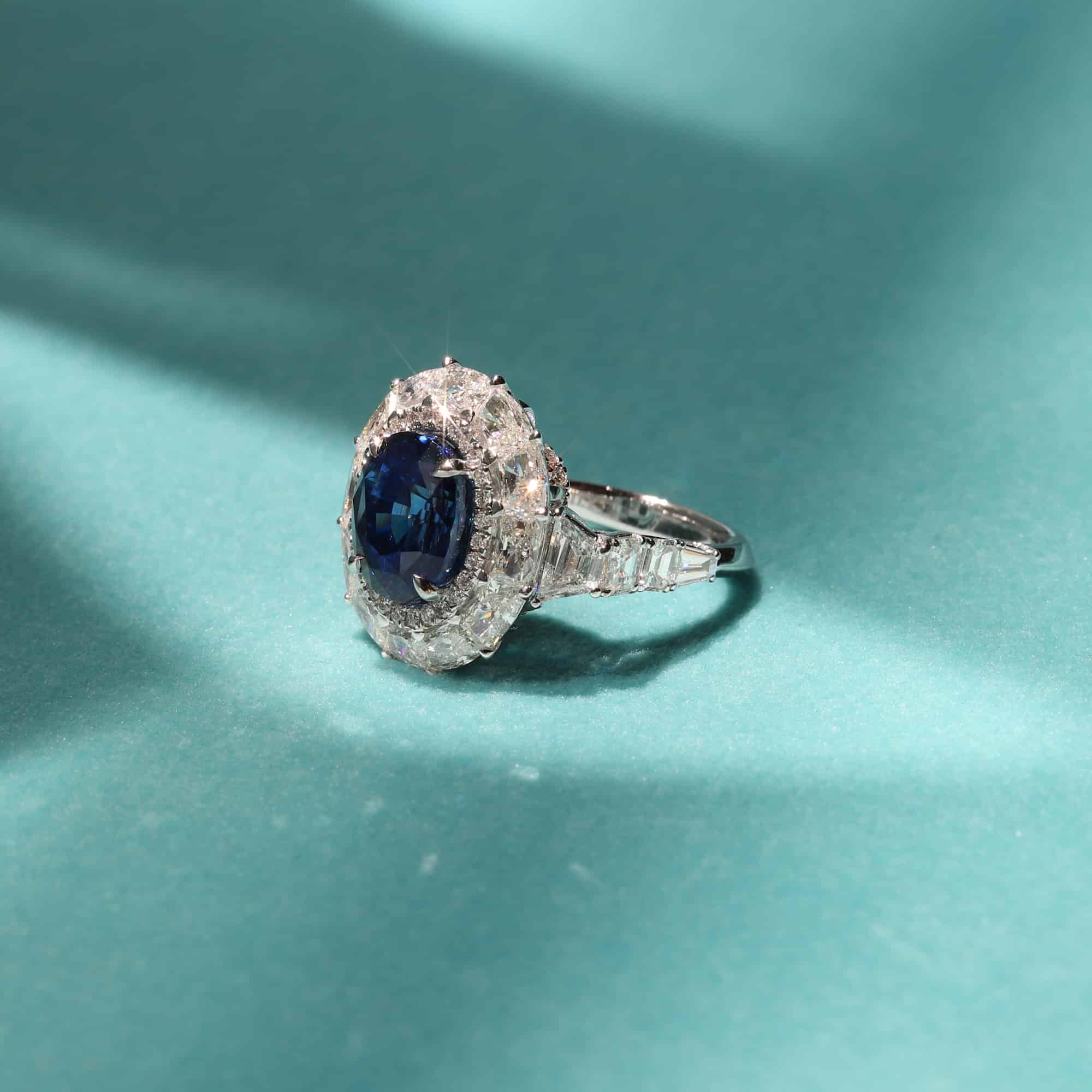 imperial looking Sapphire ring in a Timeless Diamond Halo