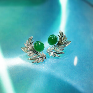 Jade studs with a diamond and mother of pearl jacket