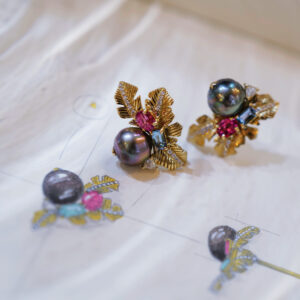 Gorgeous bespoke earrings with dark coloured pearls.