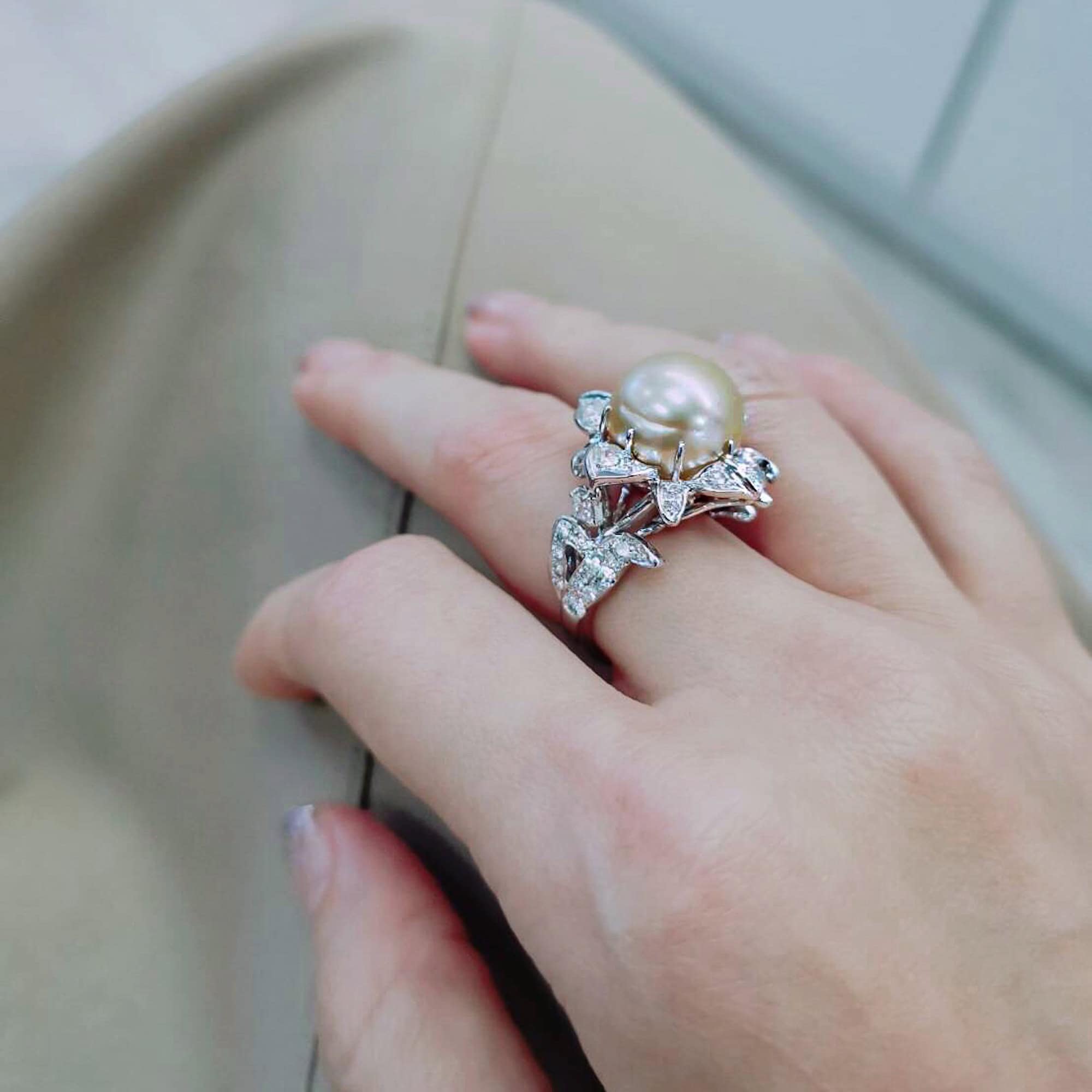 Bespoke golden toned pearl and diamond ring.