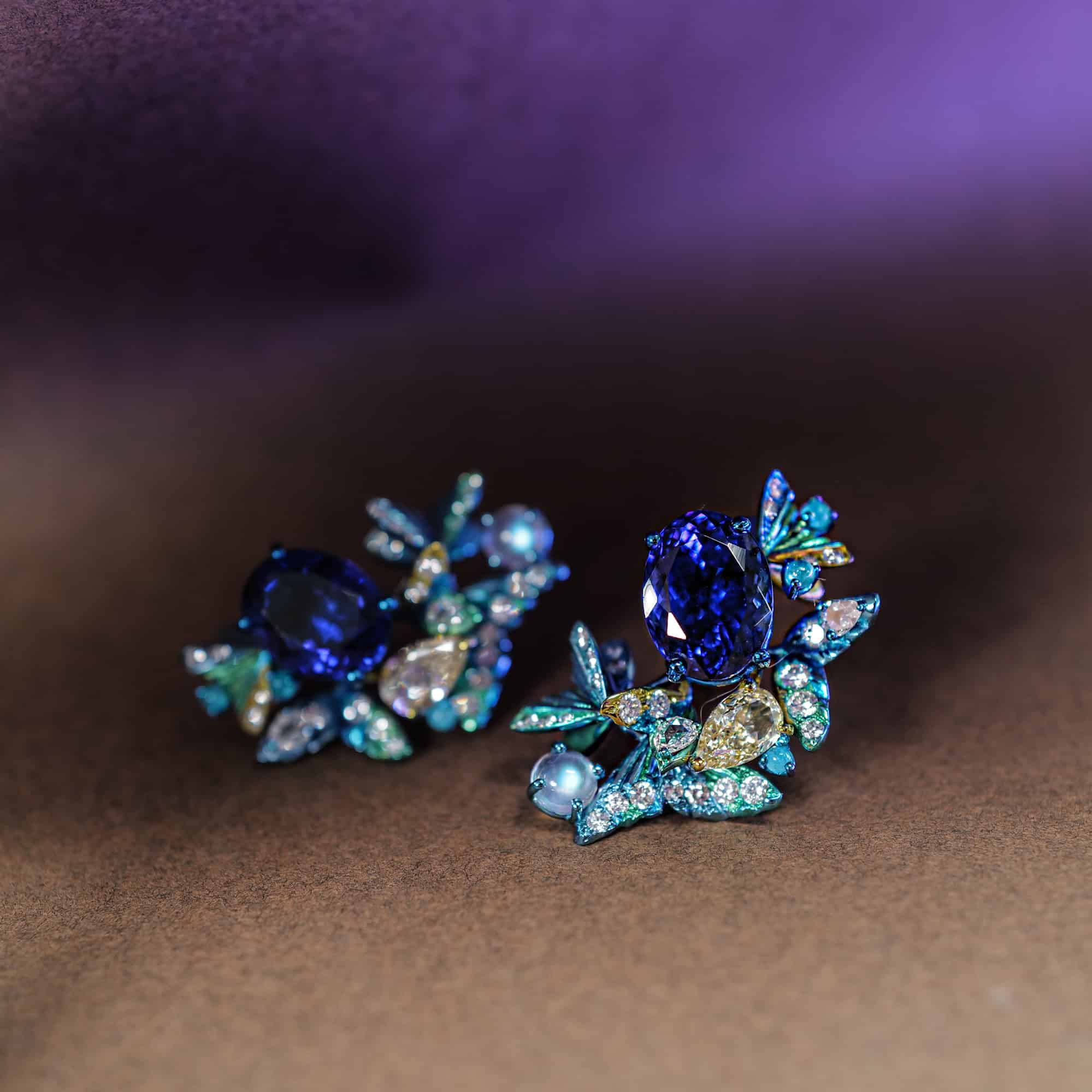 Bespoke Tanzanite earrings set in titanium with opals and diamonds.