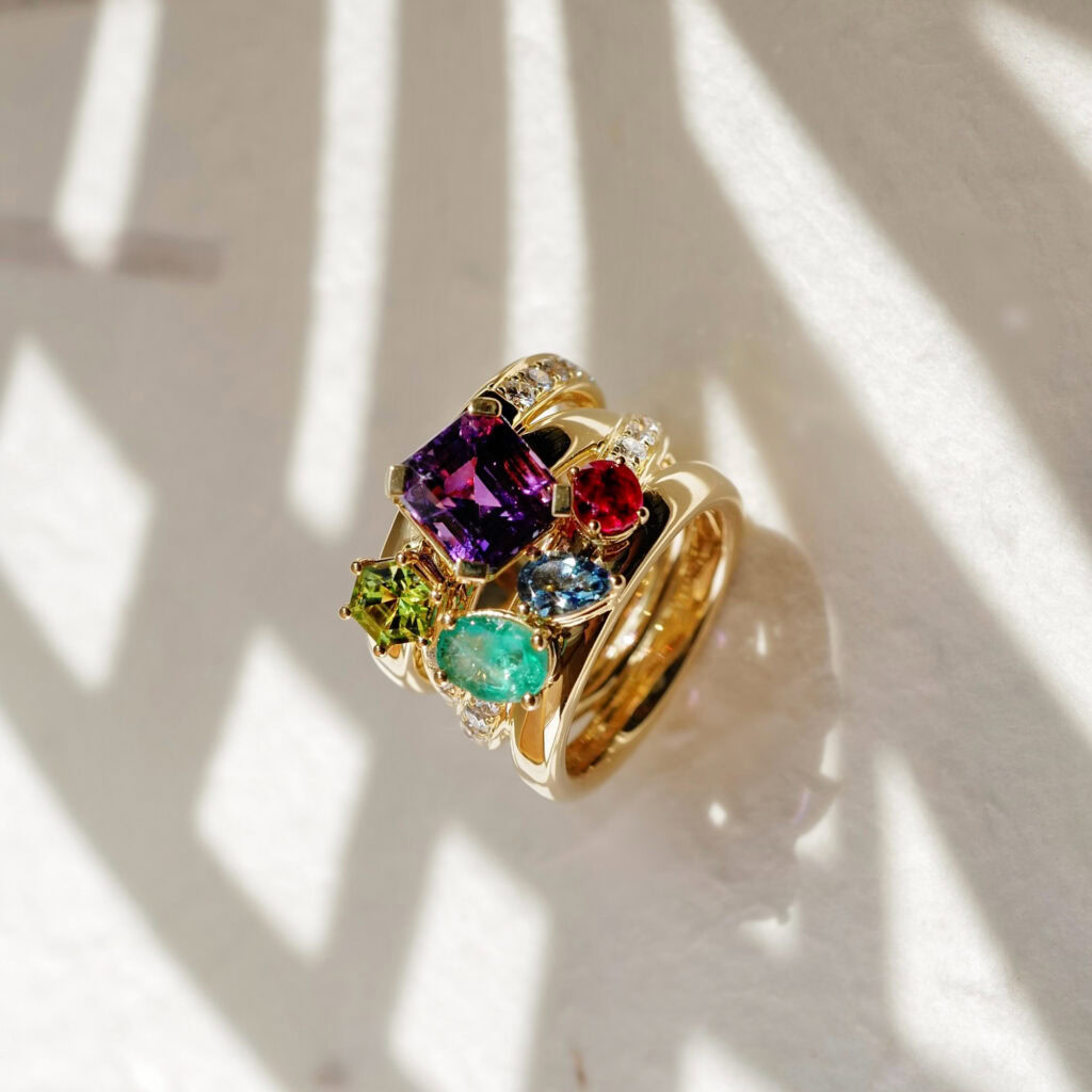 A stunning family ring featuring amethyst, peridot, emerald, ruby and aquamarine.