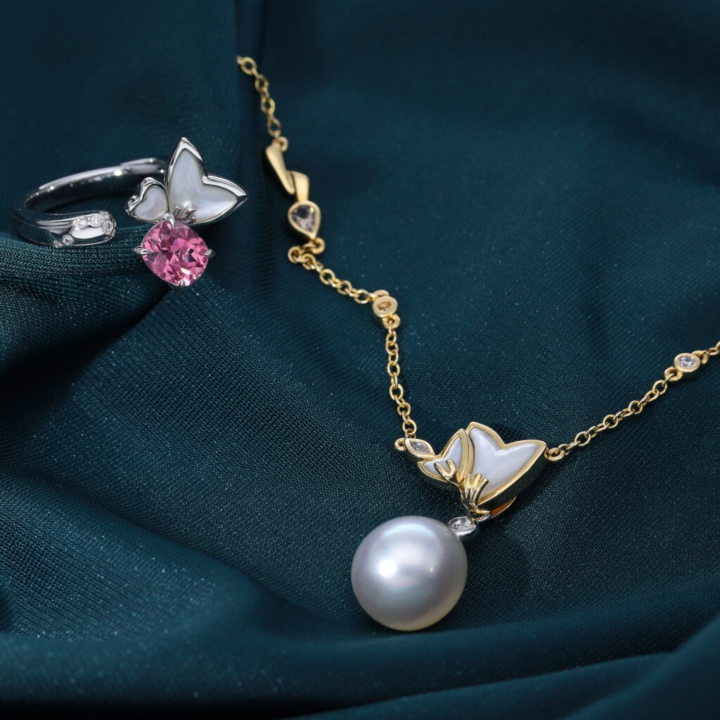 The Mirage Blossom detachable necklace, worn with a pearl drop instead of its original mother of pearl detachment. 