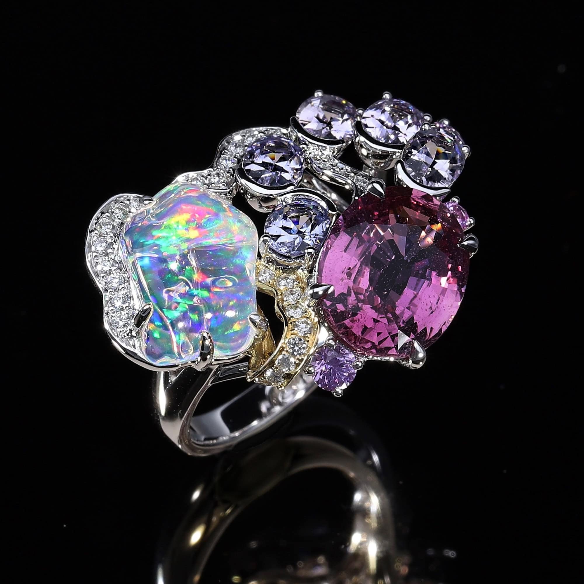 Absolutely striking cool toned pink Sapphire and a mesmerising Opal, featured in a customised ring.